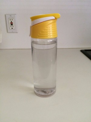 A water bottle on a kitchen counter.
