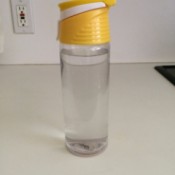 A water bottle on a kitchen counter.