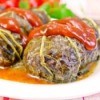 Rhubarb leaves stuffed with meat and topped with a rhubarb sauce