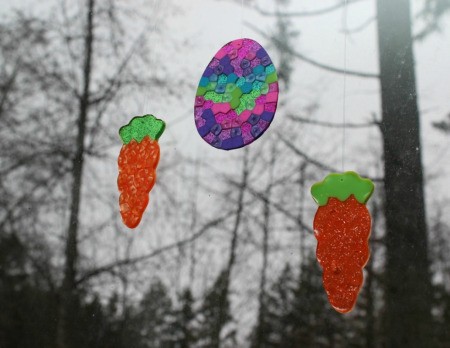 two carrots and an egg sun catcher