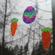 two carrots and an egg sun catcher