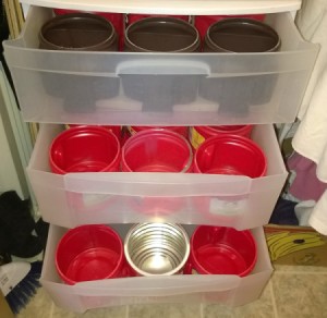 plastic drawer unit with plastic coffee cans inside