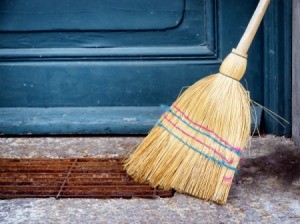 Old Broom leaning against a porch stoop