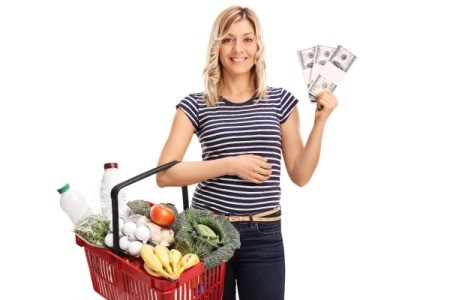Woman with Shopping Absket and Coupons