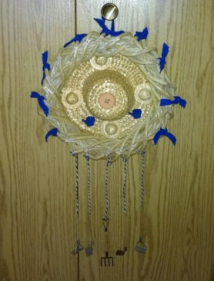 finished wreath hanging from closet knob