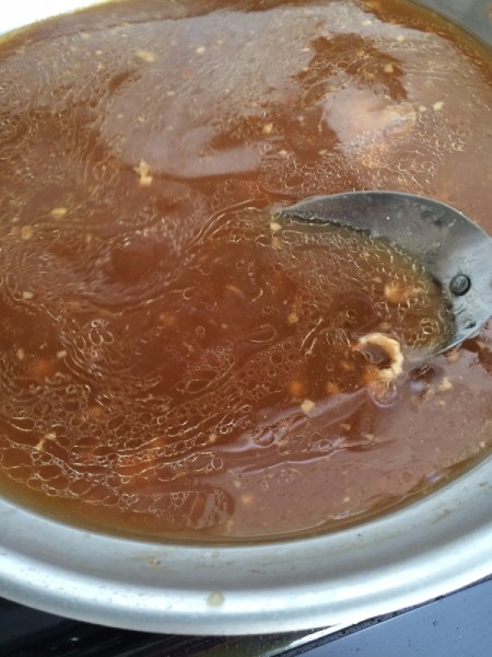 Thickening the sauce.