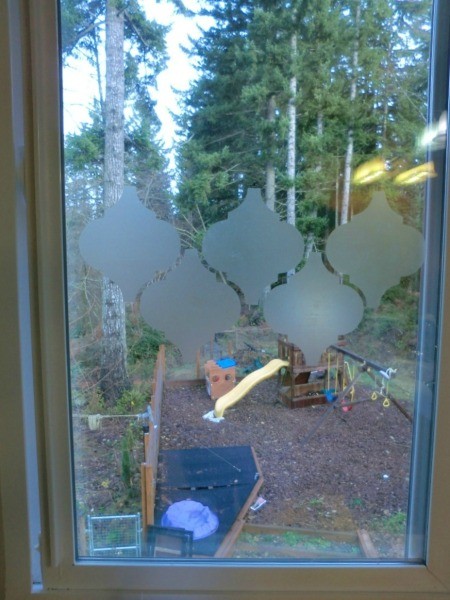 contact paper shapes being applied to small window
