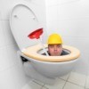 Plumber holding a plunger peeking out from inside a toilet