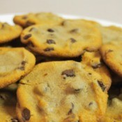 Flat chocolate chip cookies on a plate