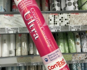 Contact paper tube in front of a contact paper display