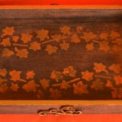 A tray with a stamped "inlay" of leaves.