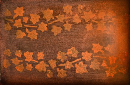 A lighter color stain was used to stamp leaves and a vine onto the bottom of the tray.