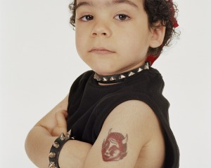 Child dressed as a "biker" with a temporary tattoo