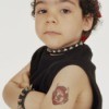 Child dressed as a "biker" with a temporary tattoo
