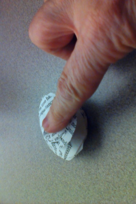 Pressing the rosette for the glue to work.