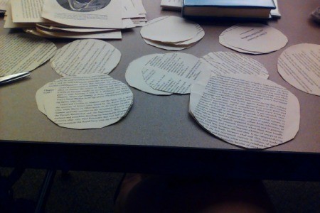 Book pages cut in circles for making rosettes.