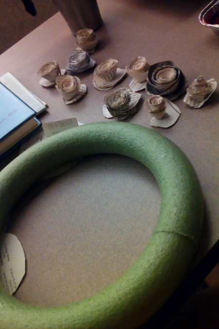 Book page rosettes and a foam wreath form.