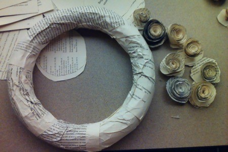 Wreath form covered in paper, ready for rosettes.