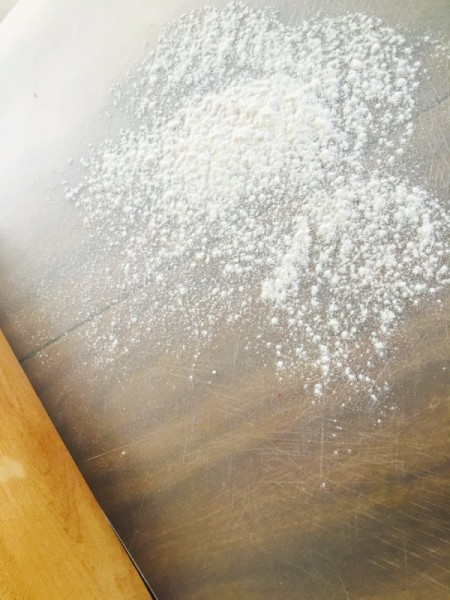 A dust of flour before rolling out empanadas.