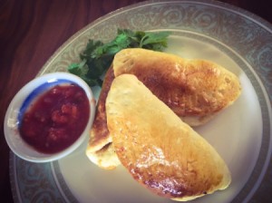 A plate of pizza dough empanadas