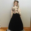 doll with long skirt and short flowered jacket