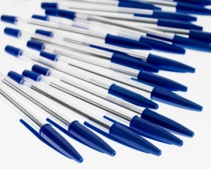 Basic blue pens spread on a white background