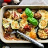 Casserole containing slices of eggplant