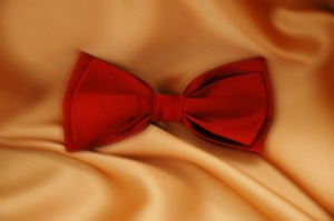 Red bowtie on a satin background