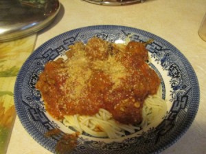 Quick Fresh Meatballs - Meatballs serviced with sauce over spaghetti noodles.