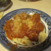 Quick Fresh Meatballs - Meatballs serviced with sauce over spaghetti noodles.