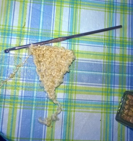 partially finished crochet wings