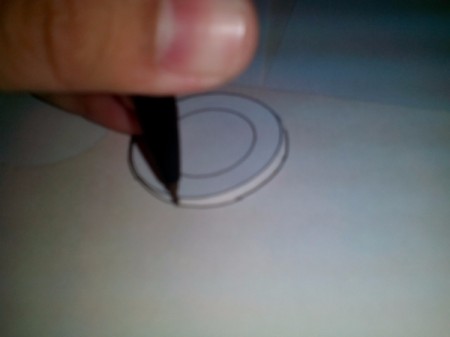 Tracing the fame template onto paper.