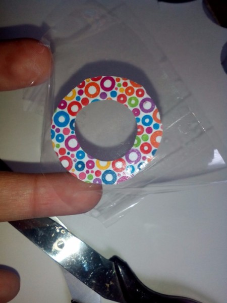 Colored paper photo frame completely cut out having tape applied to wrong side.