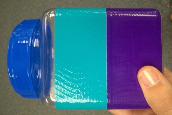 view of the back of the jar showing the two colors of tape