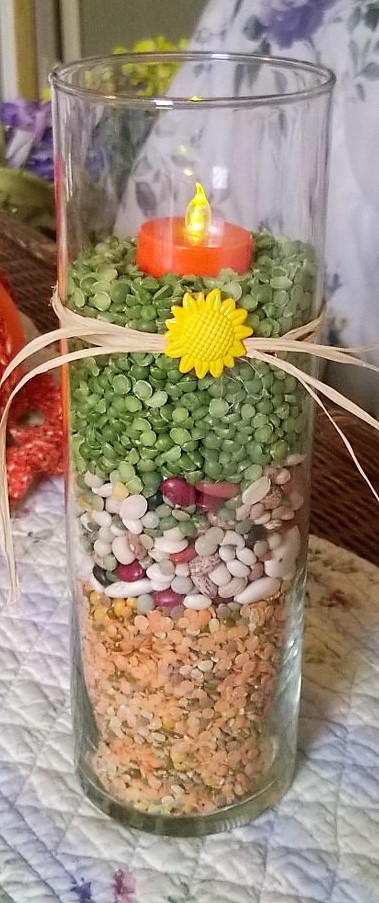 Finished vase with battery operated candle and jute bow.