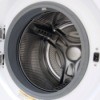 Close up of empty front load washing machine with the door open