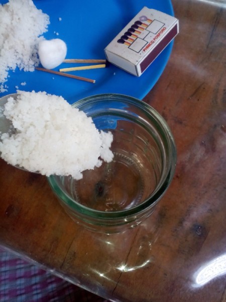 Adding the salt to the jar.