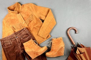Display of suede jacket, pants, boots, and umbrella