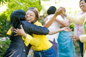 Women hugging outdoors