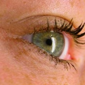 Close up of a woman's eye with thick mascara on the lashes