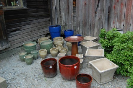 Bird Bath and several sizes of planters marked for sale.