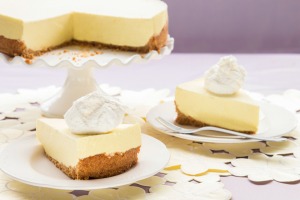 Lemon Chiffon Pie slices on plates with pie in the background