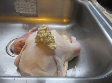 Vertical Roast Chicken - applying butter to chicken