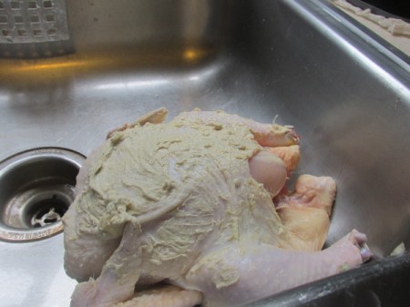 Vertical Roast Chicken - applying butter to chicken