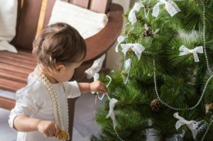 Toddler helping hand decorations on Christmas Tree