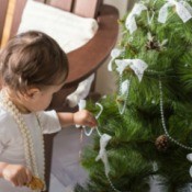 Toddler helping hand decorations on Christmas Tree