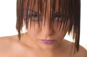 Model with heavy eye makeup and wet hair