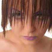 Model with heavy eye makeup and wet hair