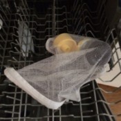 mesh bag with small items on top dishwasher rack