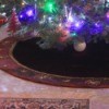 Christmas tree skirt under decorated tree